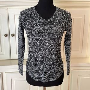 ALLEGRA x-small black and white V-neck sweater with beautiful design on front.
